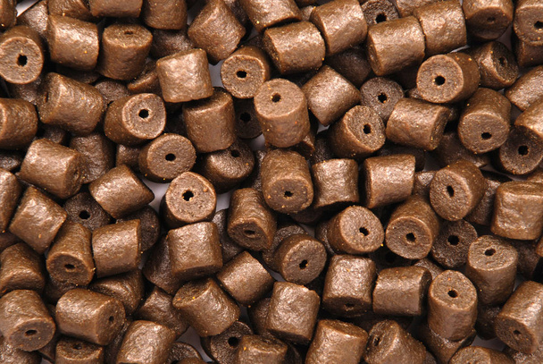 Granulés de flétan brun pré-percés
 - Photo, image