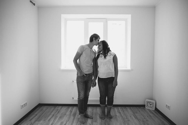 Loving couple in their new apartment - Fotoğraf, Görsel