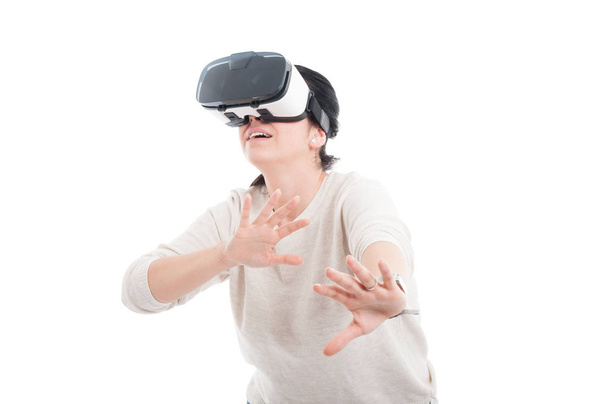 Female wearing VR headset looking scared - Foto, imagen