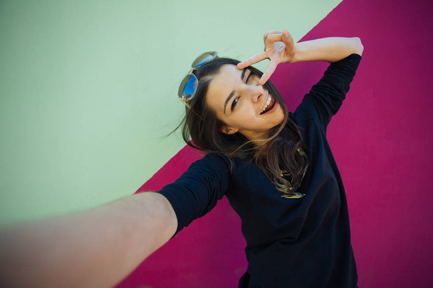 Very beautiful girl student doing selfie for instagram on vacation in Europe - Valokuva, kuva