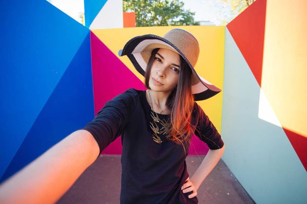 Very beautiful girl student doing selfie for instagram on vacation in Europe - 写真・画像