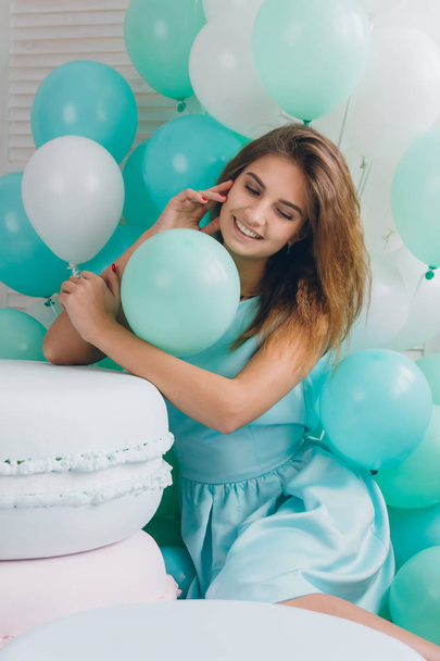 Girl in turquoise dress with balloons - Fotoğraf, Görsel