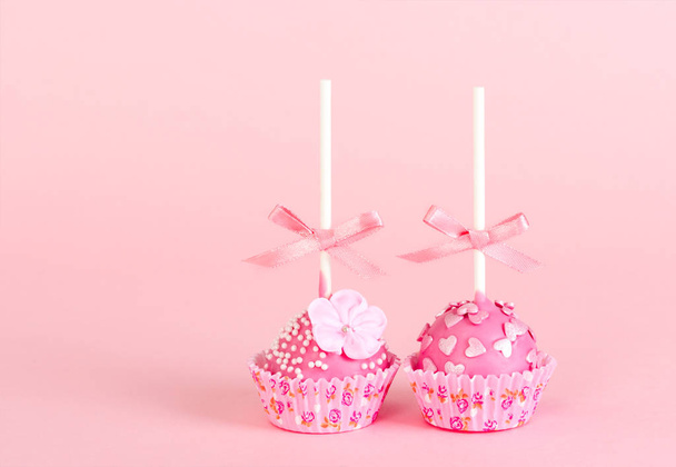 Two pop cake with pink glaze and decor  - Photo, Image