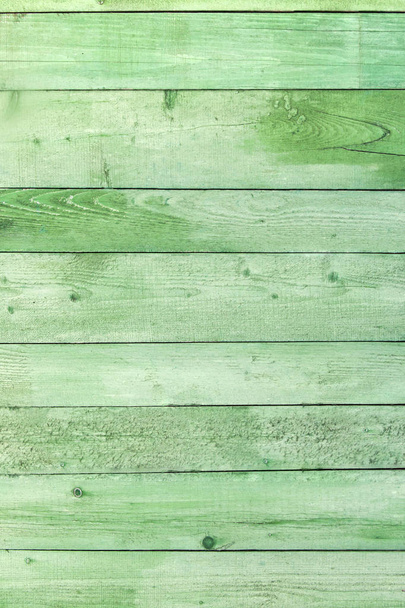 Natural weathered wooden planks background. Old painted in green - 写真・画像
