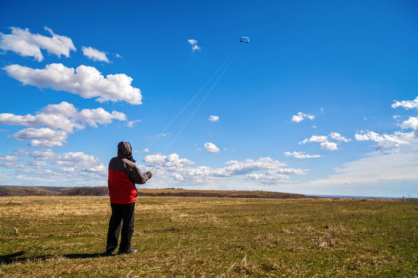 man relaxes in nature To raise a kite - Photo, image