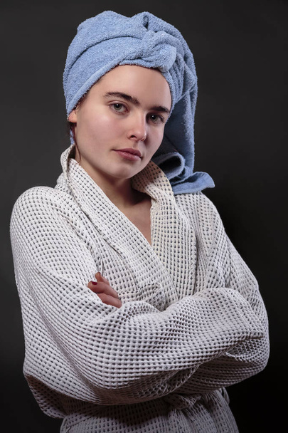 beautiful woman with bath towel on her head and  bathrobe - Foto, afbeelding