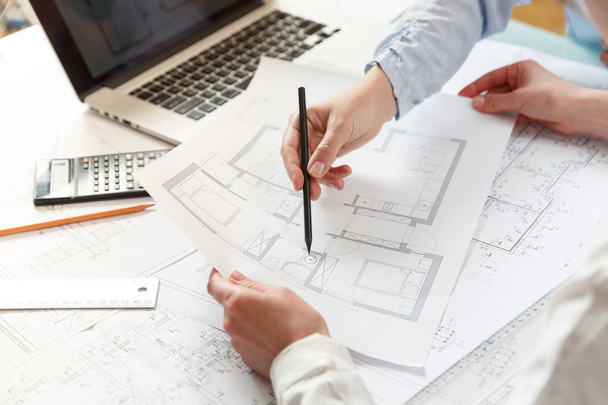 Designers work on a blueprint of new apartments - Photo, image
