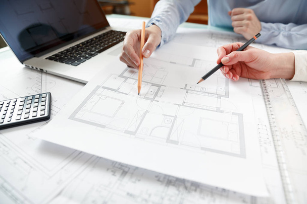 Designers work on a blueprint of new apartments - Foto, Imagen
