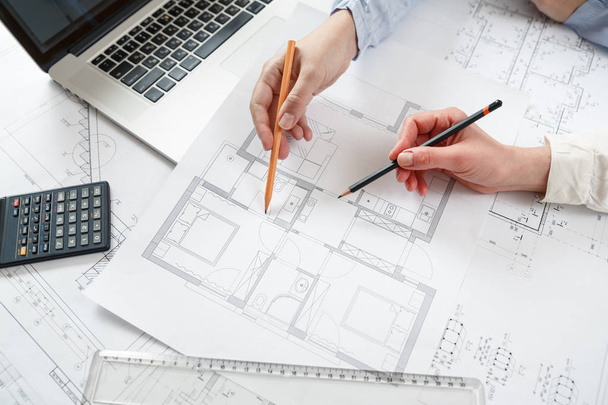Designers work on a blueprint of new apartments - Foto, imagen