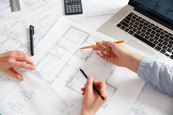 Designers work on a blueprint of new apartments - Foto, imagen