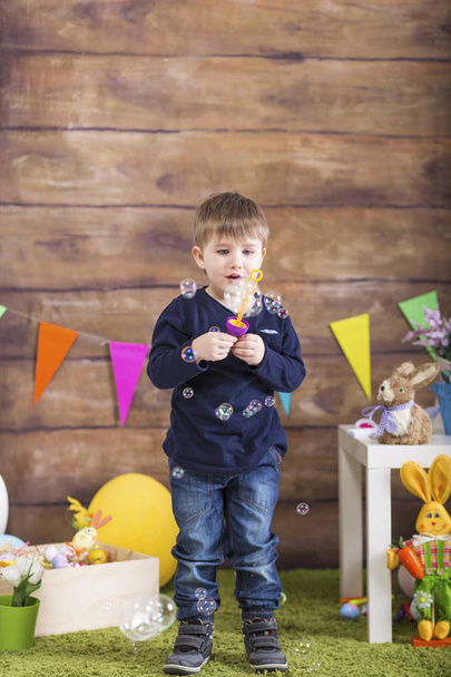 Happy Easter! Little boy with soap bubbles playing - Foto, Imagem