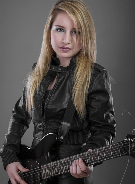 blonde with black electric guitar - Φωτογραφία, εικόνα