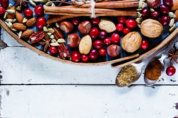 Nuts, cranberries and spices - Zdjęcie, obraz