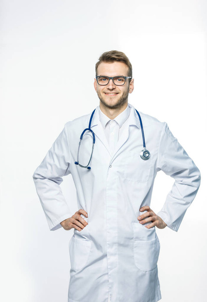 portrait - a family doctor with stethoscope on white background - Foto, imagen