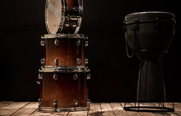 musical percussion instruments on black background drum Bongo and snare - Photo, Image