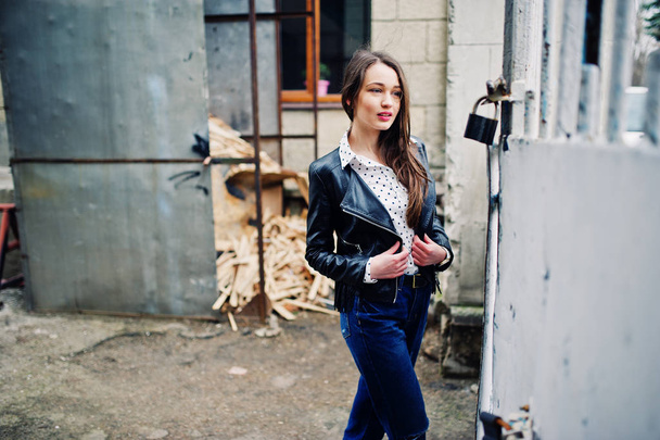 Portrait of stylish young girl wear on leather jacket and ripped - 写真・画像
