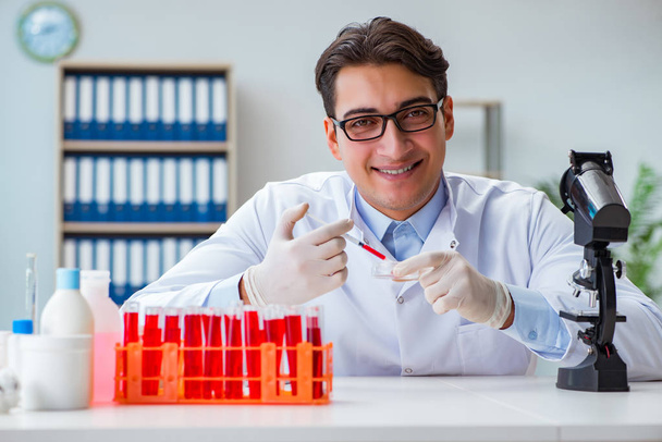Doctor working with blood samples - Photo, Image