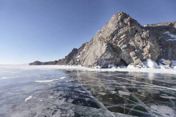 Winter landscape with cracks in ice of Lake Baikal, Oltrek islan - Photo, image