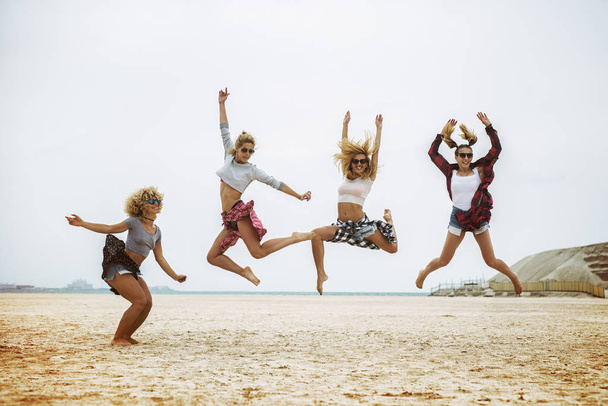 women having fun on beach - Фото, зображення