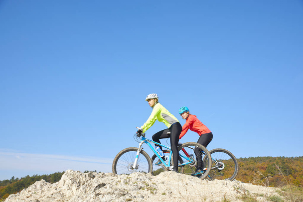 Mountain bikers training at the hillside  - Фото, зображення