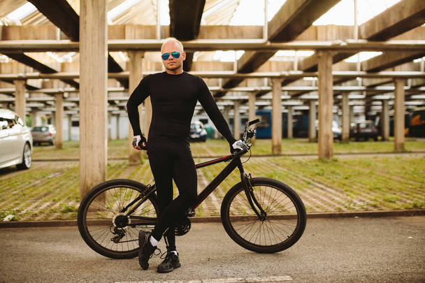 bicycle style man in black sportswear - Photo, Image