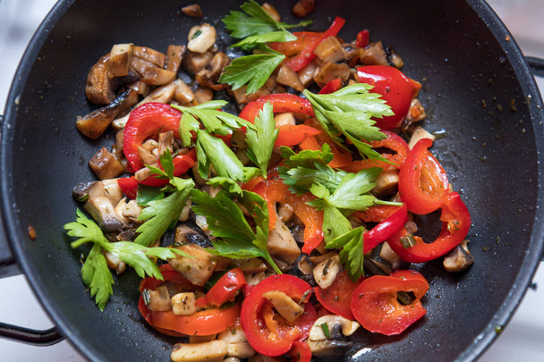 Mushrooms and fresh sweet red pepper in the pan - Zdjęcie, obraz