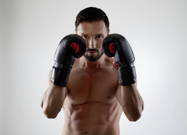 Boxer wearing boxing gloves - Photo, Image
