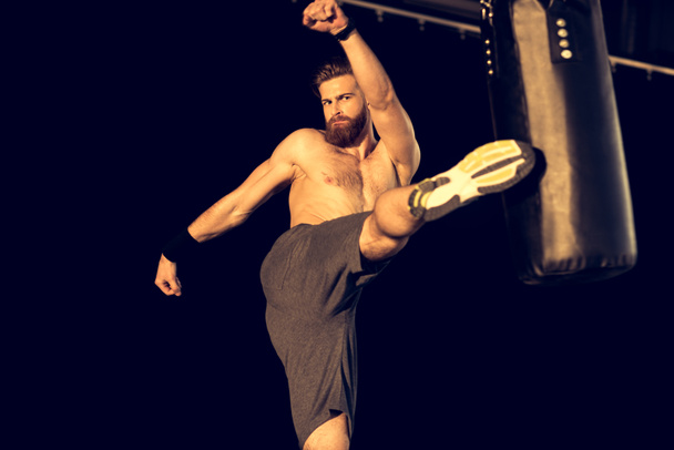 sportsman with punching bag - Photo, Image