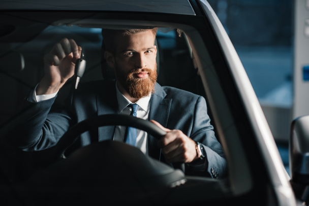 Man sitting in new car  - Photo, Image