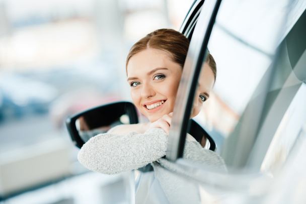 Woman sitting in new car  - Photo, Image