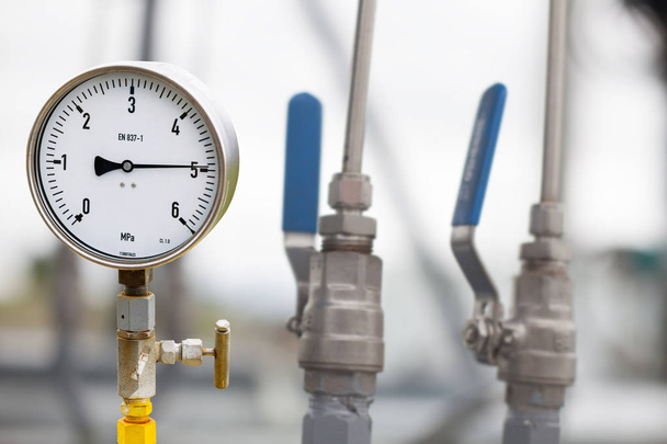 Pressure gauge in oil and gas production process for monitor con - Photo, Image