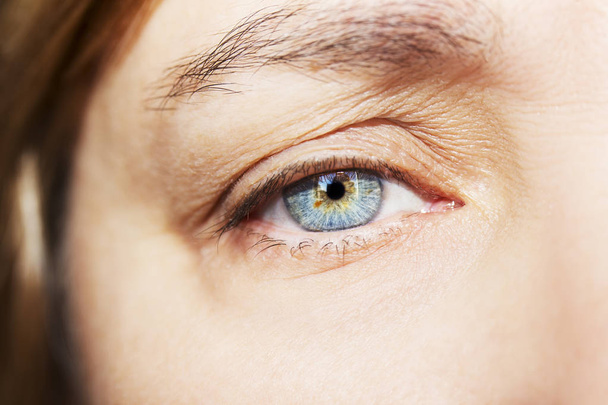 A beautiful insightful look woman's eye. Close up shot - Фото, изображение