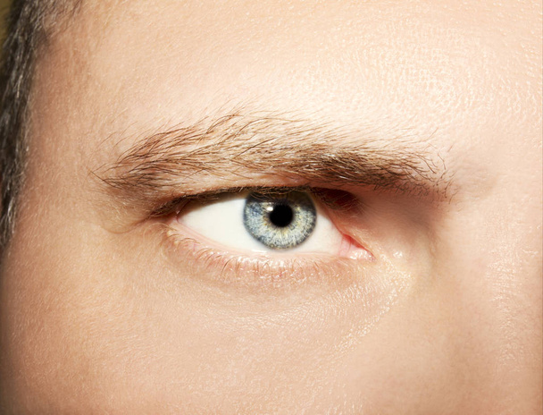 Image of man's blue eye close up. - Photo, Image