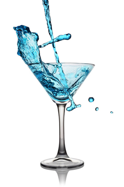 Splash in glass of a blue alcoholic cocktail drink - Fotografie, Obrázek