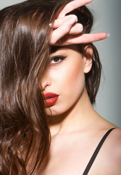 sexy woman with red lips, long brunette hair - 写真・画像