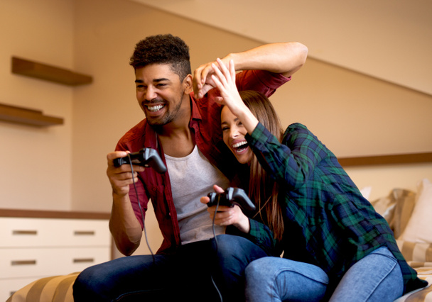 Couple playing video games - Photo, Image