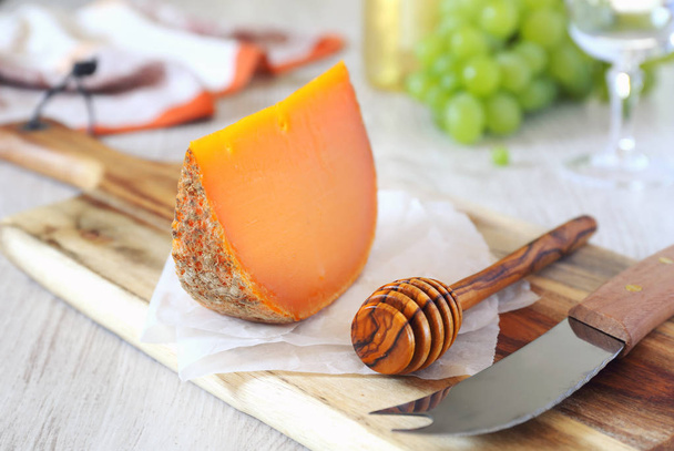 Mimolette cheese and green grapes - Photo, Image