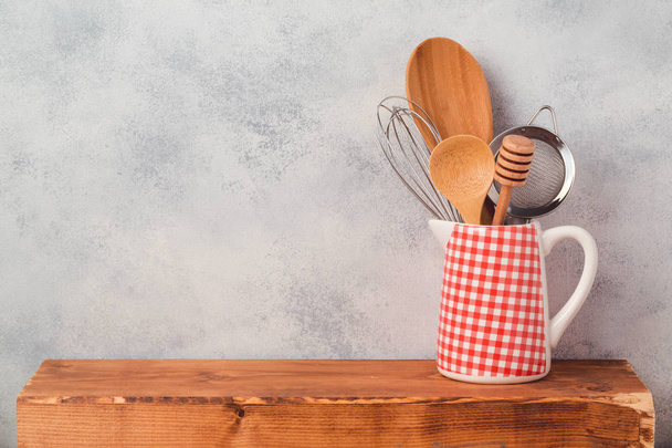 Kitchen utensils on wooden board - Fotó, kép