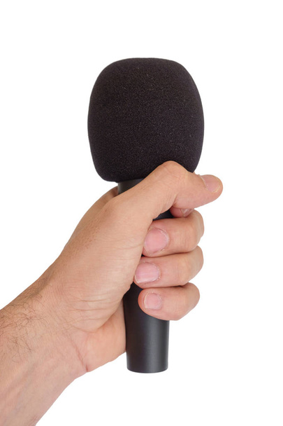 Mano sinistra con microfono isolato su sfondo bianco
 - Foto, immagini