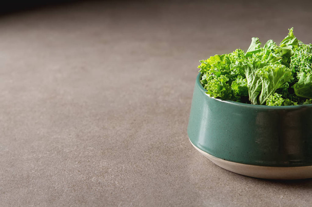 Fresh green Italian salad Kale. Dark background. - Foto, Imagem
