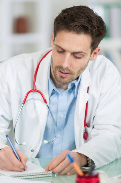 male doctor with notebook close up - Photo, Image