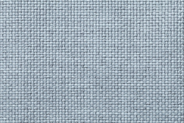 Синій фон з плетеним картатим візерунком, крупним планом. Текстура ткацької тканини, макро
. - Фото, зображення
