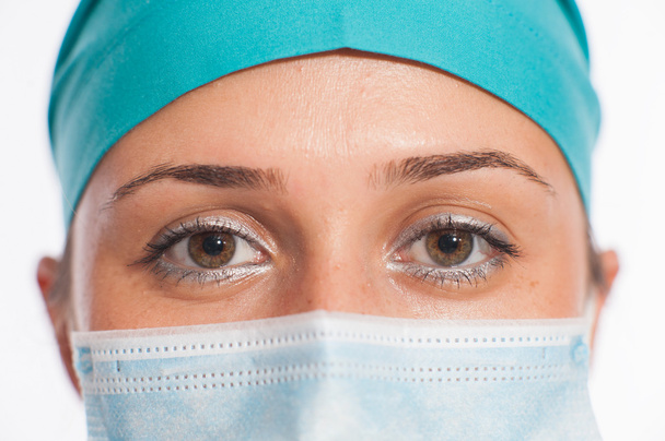 Female surgeon looking at camera at hospital - Foto, imagen