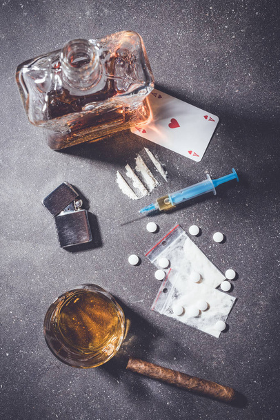 Overhead shot of hard drugs on gray stone background - Foto, afbeelding