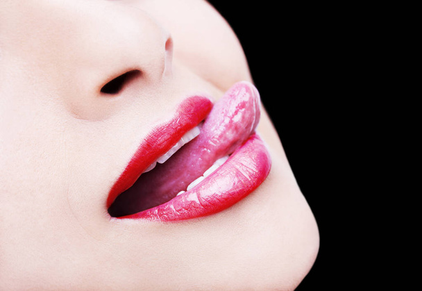 Beautiful woman leaking teeth with tongue close up - Fotografie, Obrázek
