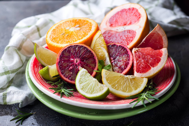 Sliced citrus fruit on the plate. - Photo, Image