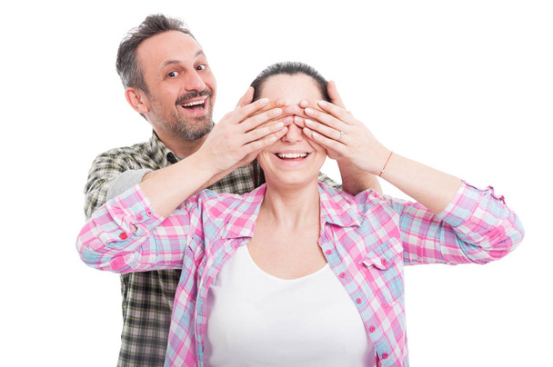 Man covering his woman eyes making a surprise - Photo, image