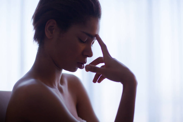 Beautiful woman resting near a window - Fotografie, Obrázek