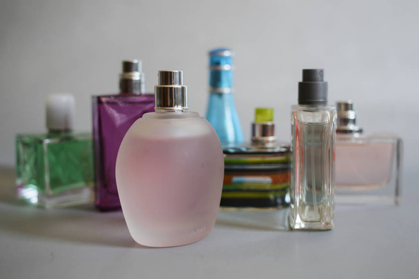 Collection of perfume on a gray background - Photo, Image