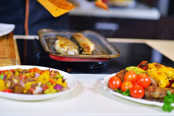 Grilled sausages with vegetables on table - Valokuva, kuva